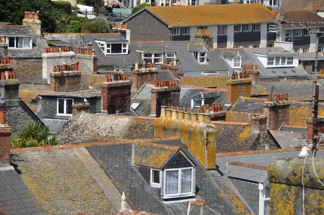 Slate rooftops, chimneys and dormer windows in St Ives.